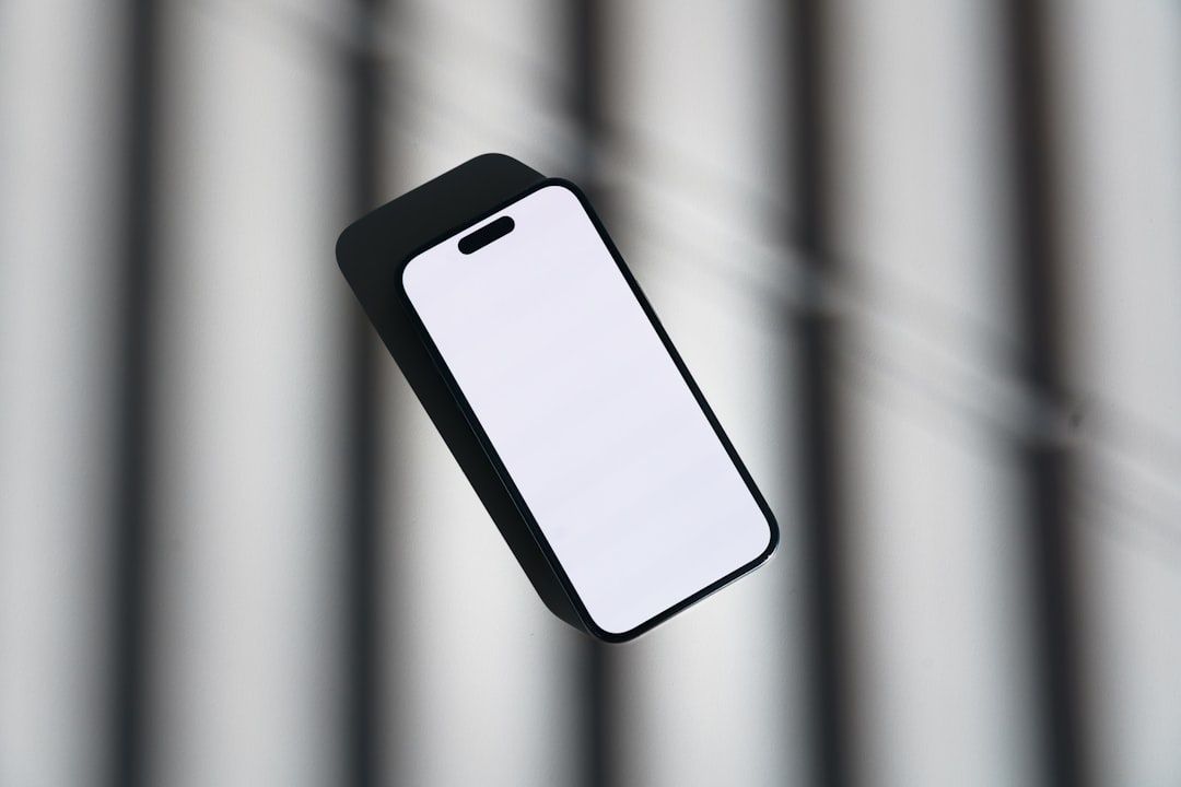 Minimalist smartphone with a blank white screen against a gray background