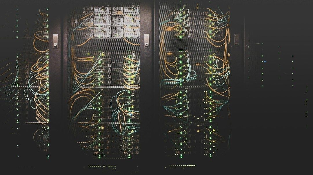 Network cables and glowing indicators inside dark data center racks